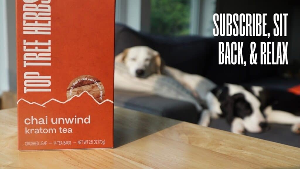 Dogs Snoozing Behind a Box of Chai Red Kratom Tea - Subscribe, Sit Back, and Relax